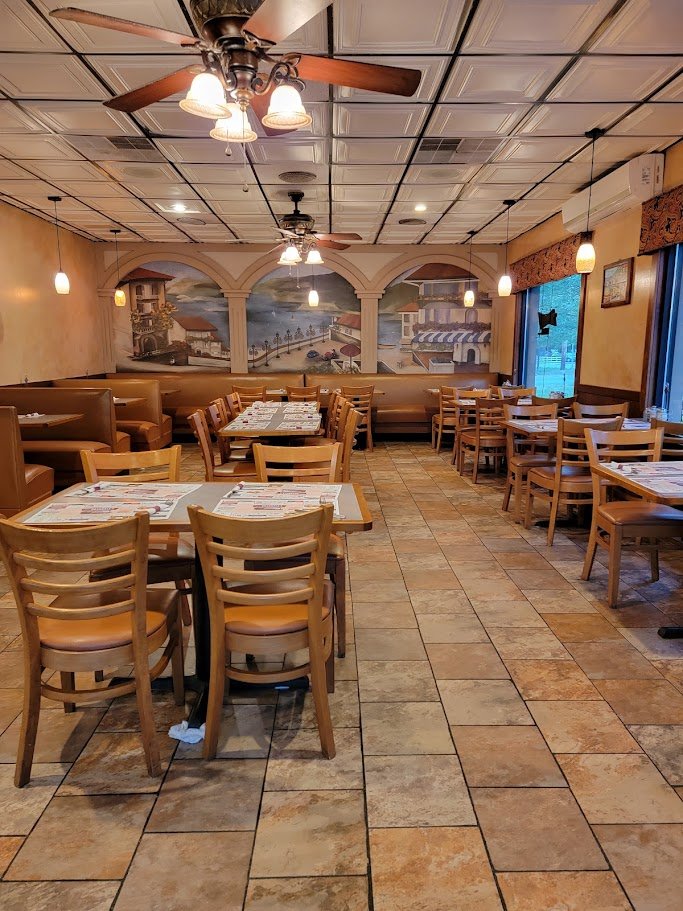 Pizza boxes stacked near the counter.